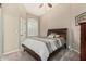 Cozy bedroom with a ceiling fan, neutral walls, carpet flooring, and window with shutters at 3835 E Leland St, Mesa, AZ 85215