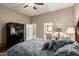 Bedroom showcasing a security safe, ceiling fan, and an ensuite bathroom at 3835 E Leland St, Mesa, AZ 85215