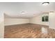 A versatile bonus room with wood floors, natural light, and ample space at 3835 E Leland St, Mesa, AZ 85215