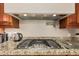 Granite countertops and stainless steel appliances make this gas cooktop shine at 3835 E Leland St, Mesa, AZ 85215