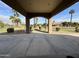 Spacious covered patio with views of manicured lawn and palm trees at 3835 E Leland St, Mesa, AZ 85215