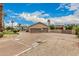 Spacious driveway leading to an attached three-car garage of a single-Gathering home at 3835 E Leland St, Mesa, AZ 85215