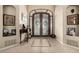 Elegant foyer features ornate double doors and decorative tile flooring at 3835 E Leland St, Mesa, AZ 85215