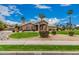 Beautiful front yard with manicured landscaping, green lawn, desert landscaping, and lovely home exterior at 3835 E Leland St, Mesa, AZ 85215