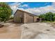 Detached garage with a large driveway and mature trees at 3835 E Leland St, Mesa, AZ 85215