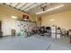 Large garage space with epoxy flooring, storage cabinets, and recreational vehicles at 3835 E Leland St, Mesa, AZ 85215