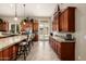 Well-lit kitchen with granite countertops, ample cabinet space, and stainless appliances at 3835 E Leland St, Mesa, AZ 85215