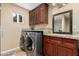 Laundry room featuring washer, dryer, and countertop at 3835 E Leland St, Mesa, AZ 85215