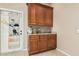 Spacious laundry room featuring cabinetry, a utility sink, and ample storage at 3835 E Leland St, Mesa, AZ 85215