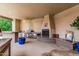 Outdoor kitchen with a built-in grill, sink, bar, and fireplace at 3835 E Leland St, Mesa, AZ 85215