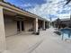 Back patio with access to the pool area and multiple seating areas at 3835 E Leland St, Mesa, AZ 85215