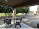 Covered patio with seating and view of pool and yard at 3835 E Leland St, Mesa, AZ 85215