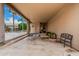 Covered patio featuring a picnic table, bench seating, and views of the pool area at 3835 E Leland St, Mesa, AZ 85215