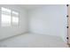 Clean bedroom featuring neutral carpet and a large window at 3909 E Gold Mountain Ave, San Tan Valley, AZ 85143