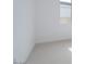 Minimalist bedroom with white walls and carpeting, accented by a bright window at 3909 E Gold Mountain Ave, San Tan Valley, AZ 85143