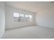 Bright bedroom with large windows providing natural light and neutral carpeting at 3909 E Gold Mountain Ave, San Tan Valley, AZ 85143