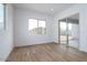 Bedroom featuring wood-look tile floors, recessed lighting, and sliding glass doors to backyard at 3909 E Gold Mountain Ave, San Tan Valley, AZ 85143