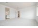 Spacious bedroom with connections to bathroom and kitchen, complemented by white carpet at 3909 E Gold Mountain Ave, San Tan Valley, AZ 85143