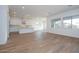 Open-concept floorplan boasts recessed lighting and wood-look tile flooring, seamlessly connecting living spaces at 3909 E Gold Mountain Ave, San Tan Valley, AZ 85143