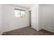 Cozy bedroom with carpet flooring and a sliding door closet at 6414 W Osborn Rd, Phoenix, AZ 85033