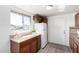 Bright kitchen with wood cabinets, countertops, and a view from the window at 6414 W Osborn Rd, Phoenix, AZ 85033