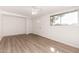 Bright, airy living room featuring modern flooring, fresh paint, and a ceiling fan at 6414 W Osborn Rd, Phoenix, AZ 85033