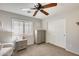 Bedroom with window, closet, and nightstand at 9131 W Albert Ln, Peoria, AZ 85382