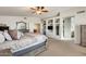 Primary bedroom with built-in shelving and ensuite bathroom at 9131 W Albert Ln, Peoria, AZ 85382