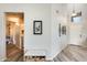 Bright entryway with wood-look flooring and storage bench at 9131 W Albert Ln, Peoria, AZ 85382