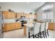 Spacious kitchen with granite countertops and light wood cabinets at 9131 W Albert Ln, Peoria, AZ 85382