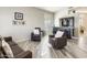 Relaxing living room with hardwood floors and comfortable seating at 9131 W Albert Ln, Peoria, AZ 85382