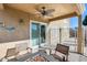 Patio with fire pit and comfortable seating at 9131 W Albert Ln, Peoria, AZ 85382