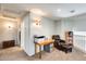 Upstairs hallway with a comfortable chair and built-in shelving at 9131 W Albert Ln, Peoria, AZ 85382