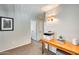 Upstairs hallway with a console table and built-in shelving at 9131 W Albert Ln, Peoria, AZ 85382