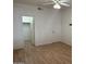 Bright bedroom with wood-look floors and walk-in closet at 9600 N 96Th St # 115, Scottsdale, AZ 85258