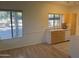 Kitchen with light wood cabinets and double sink at 9600 N 96Th St # 115, Scottsdale, AZ 85258