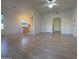 Open living room with wood-look floors and kitchen access at 9600 N 96Th St # 115, Scottsdale, AZ 85258