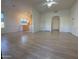 Open living room with wood-look floors and kitchen access at 9600 N 96Th St # 115, Scottsdale, AZ 85258