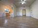 Open living room with wood-look floors and kitchen access at 9600 N 96Th St # 115, Scottsdale, AZ 85258