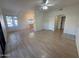 Open living room with wood-look floors and kitchen access at 9600 N 96Th St # 115, Scottsdale, AZ 85258