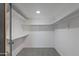 Large walk-in closet with double hanging rods and shelves at 12130 N 70Th Ave, Peoria, AZ 85345