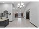 Modern kitchen with white cabinets, granite island, and stainless steel appliances at 12130 N 70Th Ave, Peoria, AZ 85345