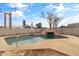 Relaxing pool area with rock waterslide and string lights at 12130 N 70Th Ave, Peoria, AZ 85345