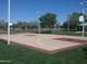 Outdoor basketball court with red and tan surface at 1449 W Iris Dr, Gilbert, AZ 85233