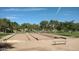 Bocce ball courts with wooden borders and a bench at 1449 W Iris Dr, Gilbert, AZ 85233