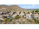 Aerial view showing home, pool, and surrounding neighborhood nestled in the foothills at 20436 N 17Th Pl, Phoenix, AZ 85024