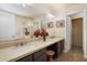 Elegant bathroom featuring double sinks, granite counters, and a separate glass enclosed shower at 20436 N 17Th Pl, Phoenix, AZ 85024