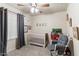 Adorable Bedroom with crib, rocker, and toys at 20436 N 17Th Pl, Phoenix, AZ 85024