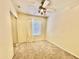 Bright bedroom with ceiling fan, carpet, and large window at 20436 N 17Th Pl, Phoenix, AZ 85024