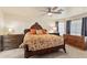 Spacious bedroom with ornate wooden furniture and large windows at 20436 N 17Th Pl, Phoenix, AZ 85024